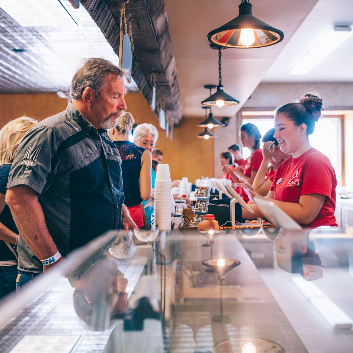 Blake's team members serving customers at the counter